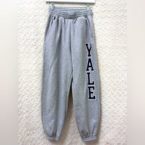 Gray sweatpants with Yale writing on the side
